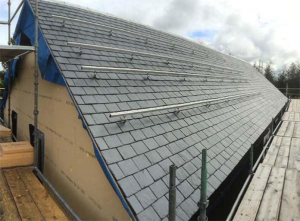 Completed slate roof with runners for the photovoltaic panels